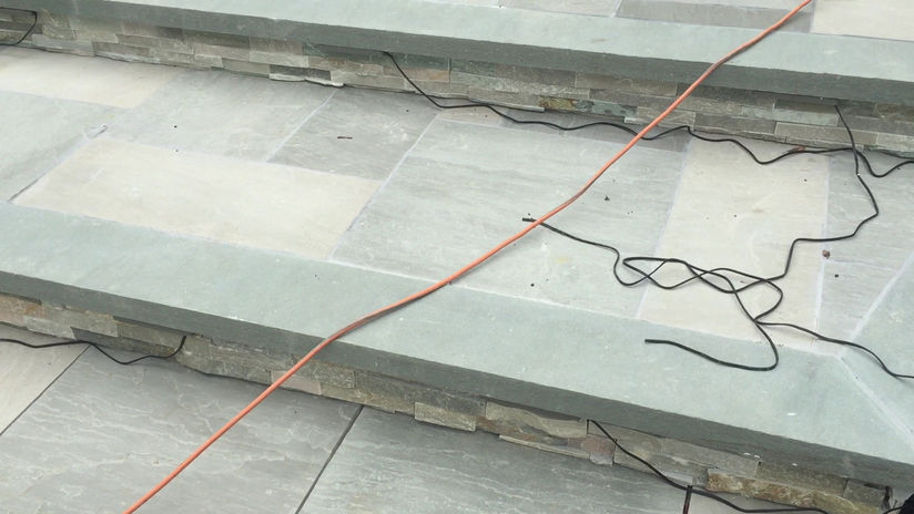 exterior walkway and front steps , natural stone tile and blustone treads